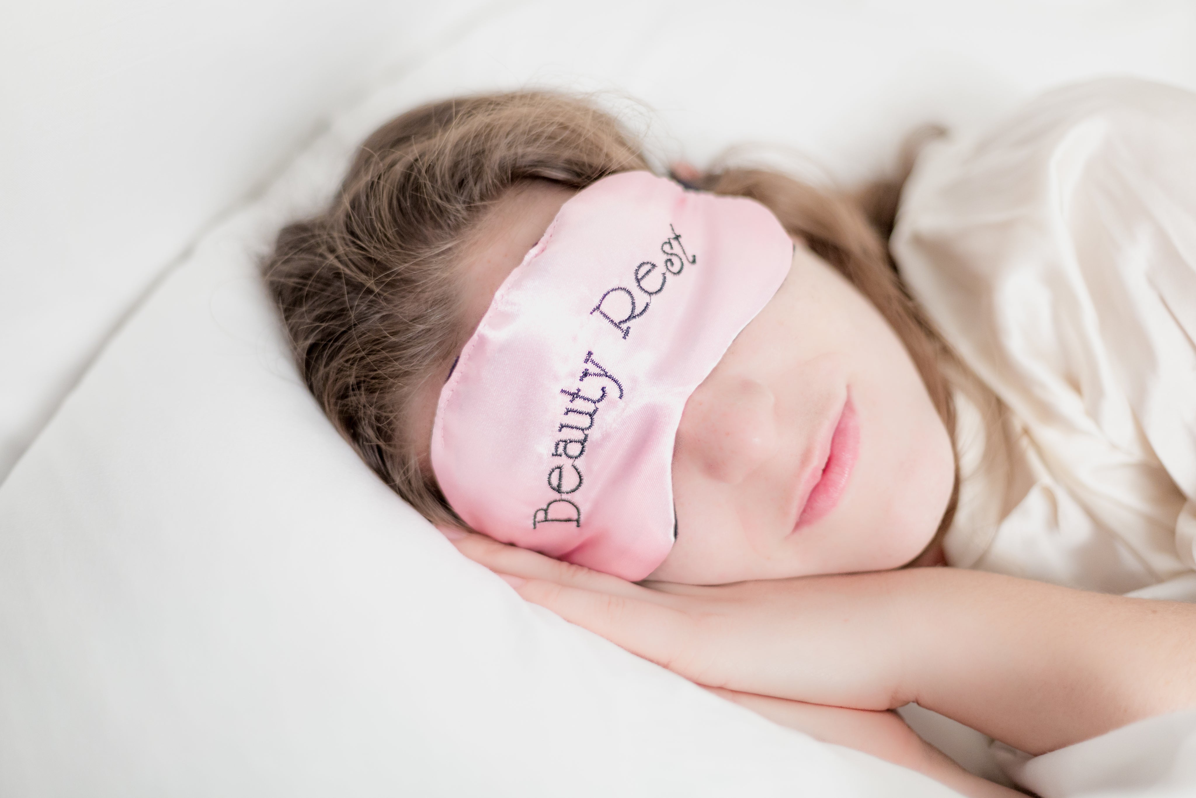woman-in-beauty-rest-mask-in-pillow.jpg